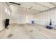 Unfinished two-car garage with extra storage space at 6025 Ames St # A, Arvada, CO 80003
