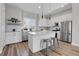 Modern kitchen with stainless steel appliances and an island at 6025 Ames St # A, Arvada, CO 80003
