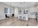 Modern kitchen with stainless steel appliances and an island at 6025 Ames St # A, Arvada, CO 80003