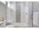 Clean walk-in shower with modern tile and glass enclosure at 6025 Ames St # A, Arvada, CO 80003