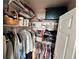 Organized closet with ample shelving and hanging space for clothes and storage at 2675 S Danube Way # 302, Aurora, CO 80013