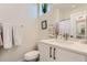 Bright bathroom featuring white vanity, toilet and mirror at 4100 E Iliff Ave # 4, Denver, CO 80222