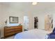 Bright bedroom featuring a wood dresser and closet at 4100 E Iliff Ave # 4, Denver, CO 80222
