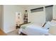 Bedroom featuring a bright queen bed and a view of the bathroom at 4100 E Iliff Ave # 4, Denver, CO 80222