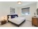 Cozy bedroom with a gray bed, stylish decor, and natural light at 4100 E Iliff Ave # 4, Denver, CO 80222