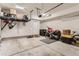 Spacious garage with storage racks and room for a vehicle, motorcycle, and more at 4100 E Iliff Ave # 4, Denver, CO 80222