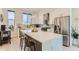 Stylish kitchen with stainless steel appliances, white cabinets, and a spacious island with seating at 4100 E Iliff Ave # 4, Denver, CO 80222