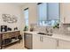 Bright kitchen with stainless steel appliances, white countertops, and view of the backyard at 4100 E Iliff Ave # 4, Denver, CO 80222