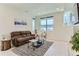Inviting living room with large window, comfortable seating, and contemporary decor at 4100 E Iliff Ave # 4, Denver, CO 80222