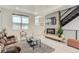 Cozy living room featuring a modern fireplace, comfortable seating, and ample natural light at 4100 E Iliff Ave # 4, Denver, CO 80222