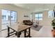 Bright living room with hardwood floors, a large window, and a dining table at 4100 E Iliff Ave # 4, Denver, CO 80222