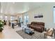 Open concept living room with hardwood floors, comfortable seating, and plenty of natural light at 4100 E Iliff Ave # 4, Denver, CO 80222