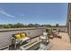 Spacious rooftop deck with dining and seating areas, perfect for outdoor entertaining with scenic views at 4100 E Iliff Ave # 4, Denver, CO 80222