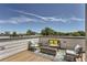 Relaxing rooftop deck featuring stylish outdoor seating, modern decor, and panoramic views at 4100 E Iliff Ave # 4, Denver, CO 80222
