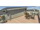 Rooftop patio featuring outdoor dining and wood decking, perfect for entertaining or relaxing outside at 4100 E Iliff Ave # 4, Denver, CO 80222