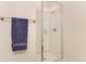 Modern bathroom shower featuring white subway tiles and a glass door at 4100 E Iliff Ave # 4, Denver, CO 80222