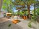 Backyard with patio, dining set, sandbox, and a playhouse at 461 Nome St, Aurora, CO 80010