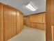 Unfinished basement with paneled walls and concrete floors at 461 Nome St, Aurora, CO 80010