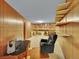 Basement featuring paneled walls, carpeting, shelving, and flexible spaces at 461 Nome St, Aurora, CO 80010