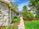 Walkway to the front entrance, with beautiful landscaping and stone accents, leading to a well-maintained home at 461 Nome St, Aurora, CO 80010