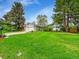 Charming single Gathering home with stone accents, a two-car garage, and a well-manicured front yard at 461 Nome St, Aurora, CO 80010