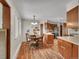 Eat-in kitchen features wood cabinets and updated appliances at 461 Nome St, Aurora, CO 80010