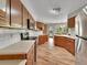 Bright kitchen with wood cabinets and stainless steel appliances at 461 Nome St, Aurora, CO 80010
