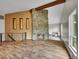 Inviting living room featuring a stone fireplace and hardwood floors at 461 Nome St, Aurora, CO 80010