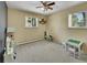 Playroom with neutral wallpaper and multiple windows to the exterior offers natural light at 461 Nome St, Aurora, CO 80010