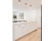 Kitchen island with white countertop and gold hardware at 2257 S Lowell Blvd, Denver, CO 80219