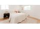 Tranquil main bedroom with a cozy bed, side tables, and a decorative rug on hardwood floors at 2257 S Lowell Blvd, Denver, CO 80219