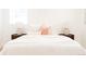 Serene main bedroom with plush bedding, decorative lamps, and stylish nightstands at 2257 S Lowell Blvd, Denver, CO 80219