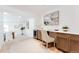 Dedicated office space with custom cabinets, desk, and view to dining room at 2257 S Lowell Blvd, Denver, CO 80219