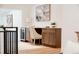 Dedicated office space with custom cabinets, desk, and beverage refrigerator at 2257 S Lowell Blvd, Denver, CO 80219