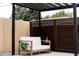 Relaxing outdoor patio with privacy screen and a comfortable chair, creating a serene space for outdoor living at 2257 S Lowell Blvd, Denver, CO 80219