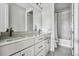 Bathroom featuring a double vanity with stone countertops and modern finishes at 11053 Bright Sky Cir, Littleton, CO 80125