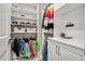 Walk-in closet with custom shelves, hanging rods, and overhead storage at 11053 Bright Sky Cir, Littleton, CO 80125