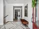 Bright entryway features wood floors, bench seating and decorative accents at 11053 Bright Sky Cir, Littleton, CO 80125