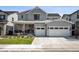 Charming two-story home with a well-manicured lawn and a spacious two car attached garage at 11053 Bright Sky Cir, Littleton, CO 80125