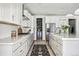 Modern kitchen with stainless steel appliances, sleek cabinets, and a convenient pantry at 11053 Bright Sky Cir, Littleton, CO 80125
