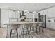 Spacious kitchen features a large island with seating, ample cabinets, and modern style at 11053 Bright Sky Cir, Littleton, CO 80125