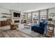 Cozy living room features a fireplace, wood floors, and an open floor plan at 11053 Bright Sky Cir, Littleton, CO 80125