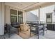 Outdoor patio featuring a round fire pit and comfortable seating on a patterned rug, perfect for entertaining at 11053 Bright Sky Cir, Littleton, CO 80125