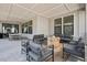 View of patio with a fire pit, seating, a dining table, and a partial view of the backyard at 11053 Bright Sky Cir, Littleton, CO 80125