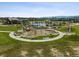 A charming playground features modern equipment in a Gathering-friendly community surrounded by lush grass and well-maintained landscaping at 11053 Bright Sky Cir, Littleton, CO 80125