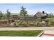 Community entrance sign: 'High Line House, 11485 Roxborough Park Road' surrounded by lush landscaping and green lawns at 11053 Bright Sky Cir, Littleton, CO 80125