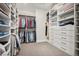 Organized walk-in closet with shelving, hanging rods, and ample storage space at 11053 Bright Sky Cir, Littleton, CO 80125