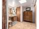 Bathroom with cabinet-style vanity, tile floor, and storage armoire at 1016 Stearns Ave, Boulder, CO 80303