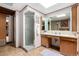 Bathroom featuring a glass-enclosed shower, a sink vanity, and a large mirror at 1016 Stearns Ave, Boulder, CO 80303