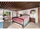 Bedroom with desk area, carpet flooring, wood ceiling, and large picture window at 1016 Stearns Ave, Boulder, CO 80303